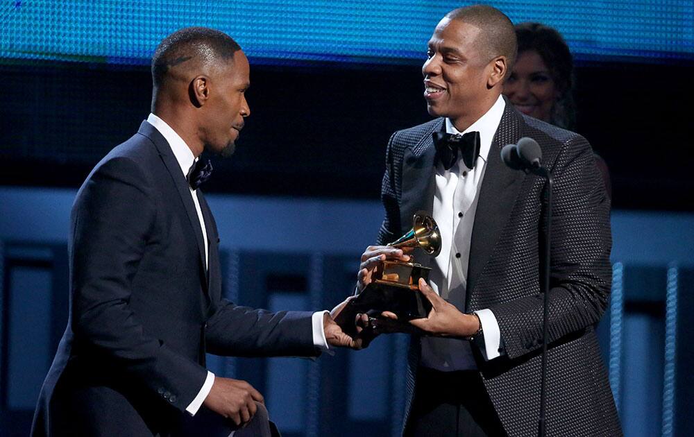 Jamie Foxx presents Jay-Z with the award for best rap/sung collaboration at the 56th annual Grammy Awards.