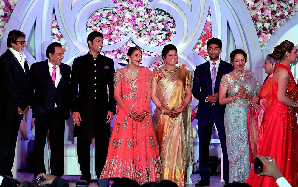 Bollywood actress Hema Malini and Dharmendra , Amitabh Bachchan , Ahana Deol with Vaibhav Arora at the wedding reception in Mumbai.