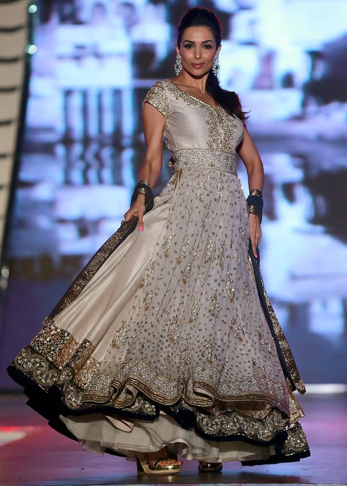 Actress Malaika Arora displays an outfit by Indian designer Manish Malhotra during a fashion show to support the cause of saving and empowering the female child in Mumbai.