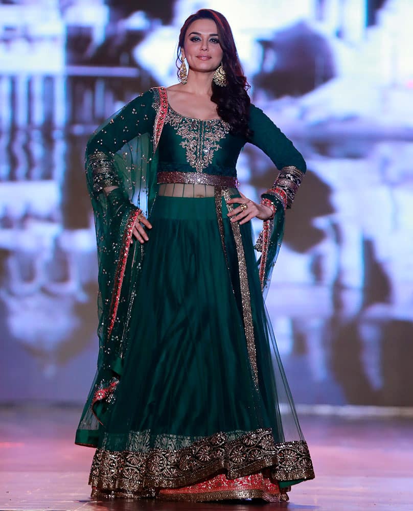 Bollywood actress Prety Zinta displays an outfit by Indian designer Manish Malhotra during a fashion show to support the cause of saving and empowering the female child in Mumbai.