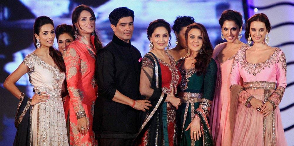 Bollywood actresses Madhuri Dixit Nene, Preity Zinta, Lara Dutta, Malaika Arora Khan and Isha Koppikar pose with fashion designer Manish Malhotra on the ramp for ‘Save & Empower the Girl Child’ initiative by Lilavati hospital in Mumbai.