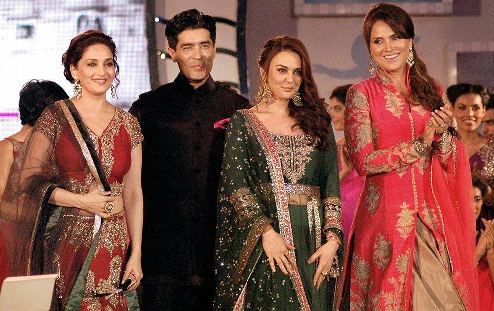 Bollywood actresses Madhuri Dixit Nene, Preity Zinta and Lara Dutta pose with fashion designer Manish Malhotra on the ramp for ‘Save & Empower the Girl Child’ initiative by Lilavati hospital in Mumbai.