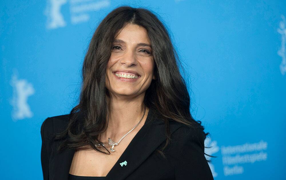 Actress Popi Tsapanidou poses for photographers at the photo call for the film Stratos during the 64th Berlinale International Film Festival.