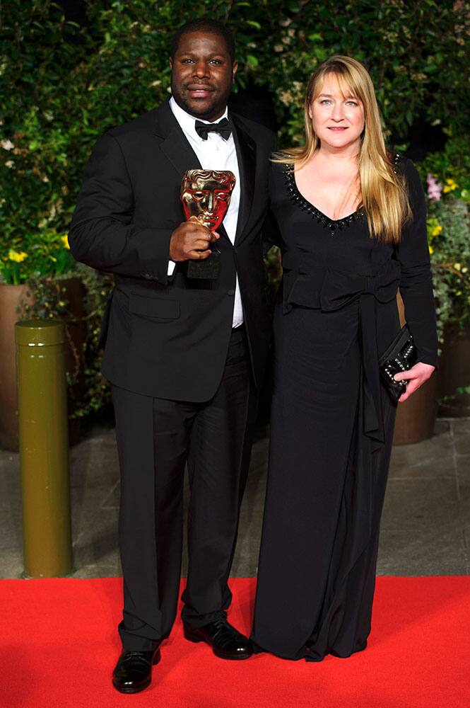 From left, British director Steve McQueen and Bianca Stigter arrive for the British Academy Film Awards 2014 After Party at the Grosvenor Hotel, in central London.