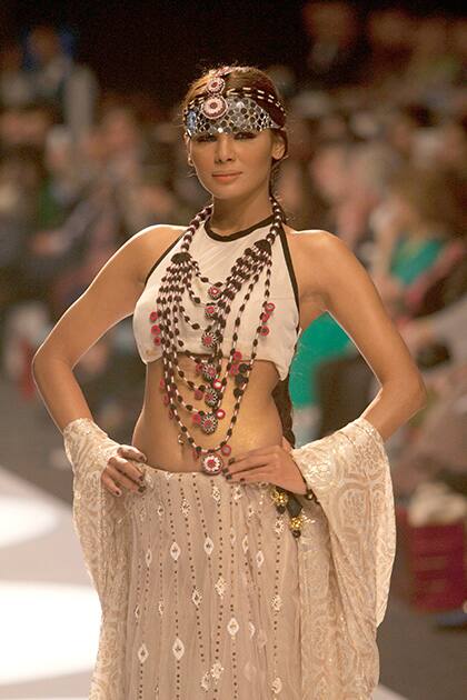 A Pakistani model presents a creation by designer Inaaya, during Fashion Pakistan Week, in Karachi, Pakistan.