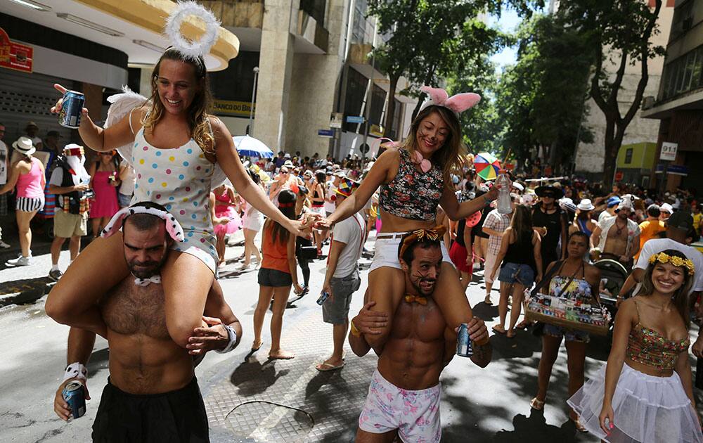 Revelers in costume partake in the Boitata block party, a pre-Carnival celebration in Rio de Janeiro, Brazil.