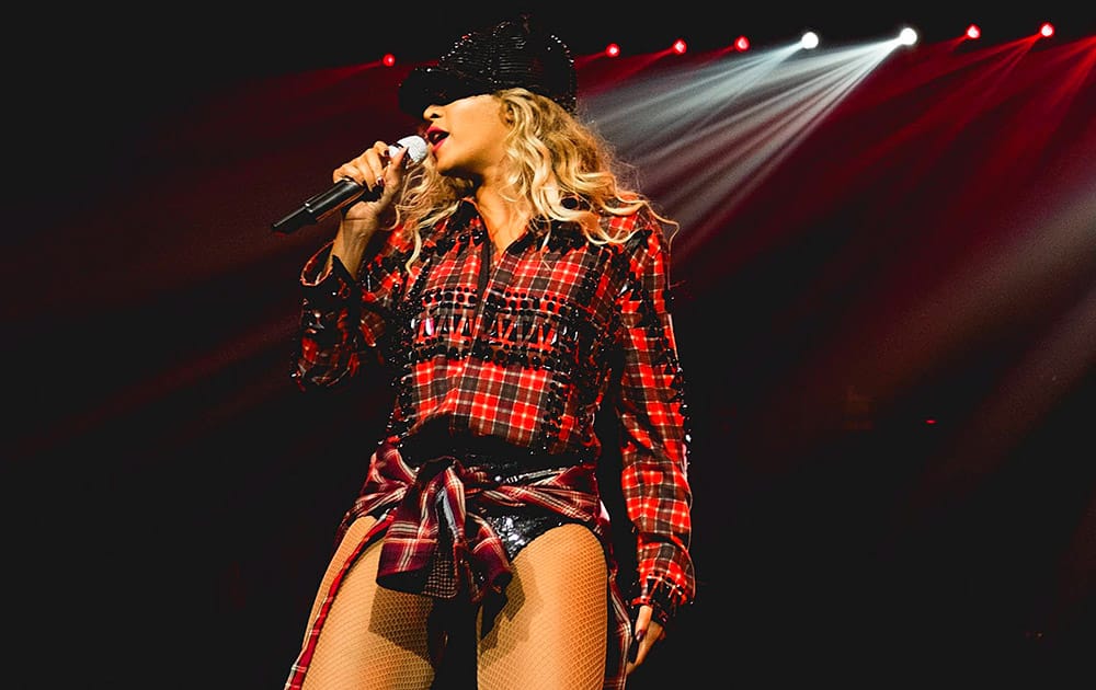 Beyonce performs onstage on her `Mrs. Carter Show World Tour 2014,` at the Phones 4u Arena in Manchester, United Kingdom.