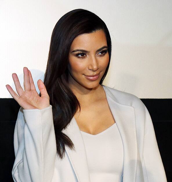 Television personality Kim Kardashian waves prior to a news conference in Vienna, Austria. Kardashian will be Austrian businessman Richard Lugner's special guest at this year's Opera Ball.