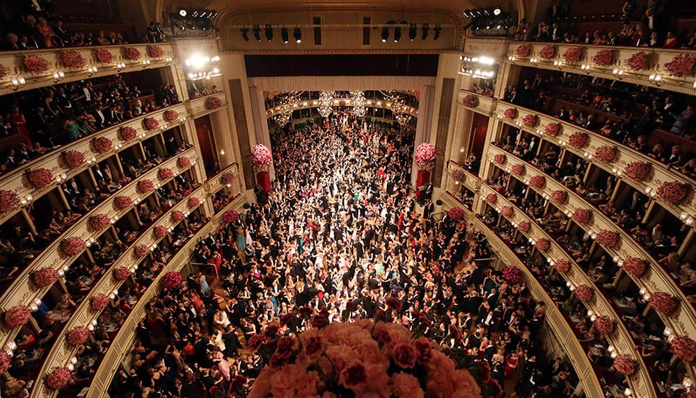 Dancers crowd the dance floor during traditional Opera Ball in Vienna, Austria.