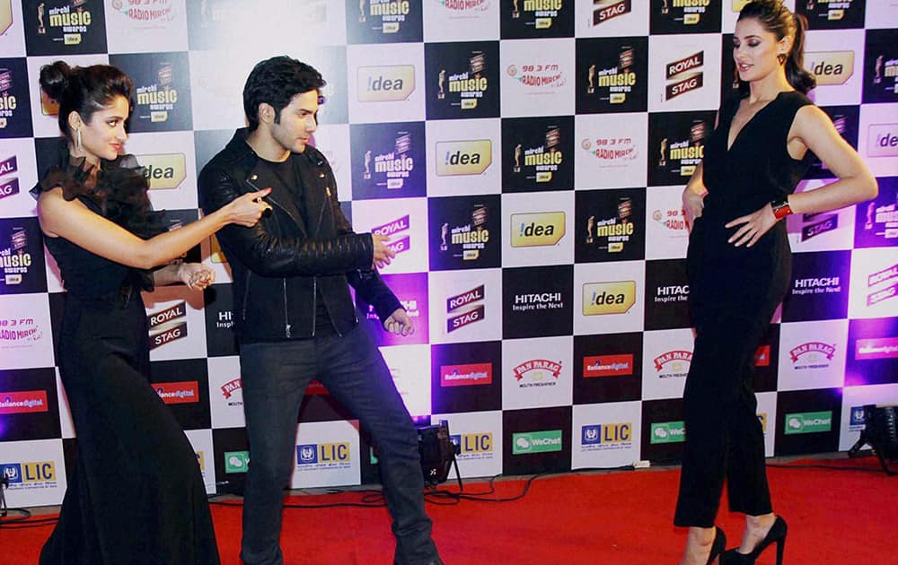 Varun Dhawan, Ileana D'Cruz, and Nargis Fakhri during the 6th Mirchi Music Awards 2014 in Mumbai.