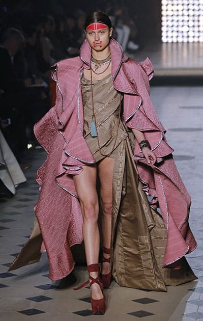 A model presents a creation as part of Vivienne Westwood's ready-to-wear fall/winter 2014-2015 fashion collection presented in Paris.