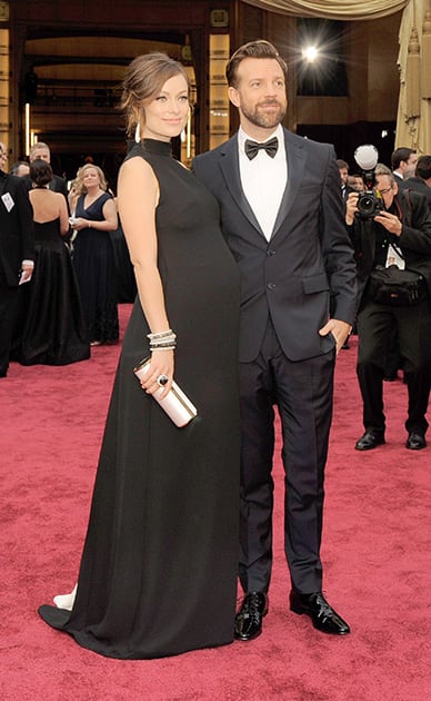 Olivia Wilde, and Jason Sudeikis arrive at the Oscars, at the Dolby Theatre in Los Angeles.