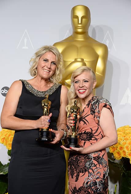 Beverley Dunn and Catherine Martin pose in the press room with the award for best production design for 'The Great Gatsby' during the Oscars at the Dolby Theatre, in Los Angeles.