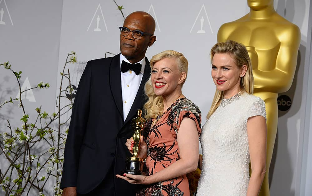 Presenters Samuel L. Jackson and Naomi Watts, pose in the press room with Catherine Martin, winner of the award for best costume design for 'The Great Gatsby' during the Oscars at the Dolby Theatre.