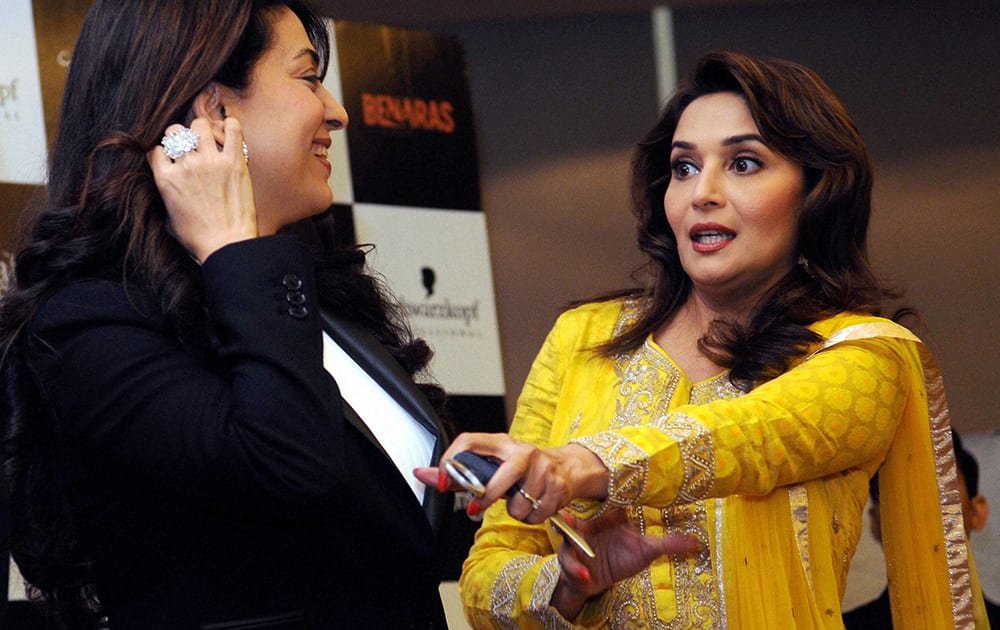 Madhuri Dixit and Juhi Chawla at a promotional event for their film 'Gulaab Gang' in New delhi.