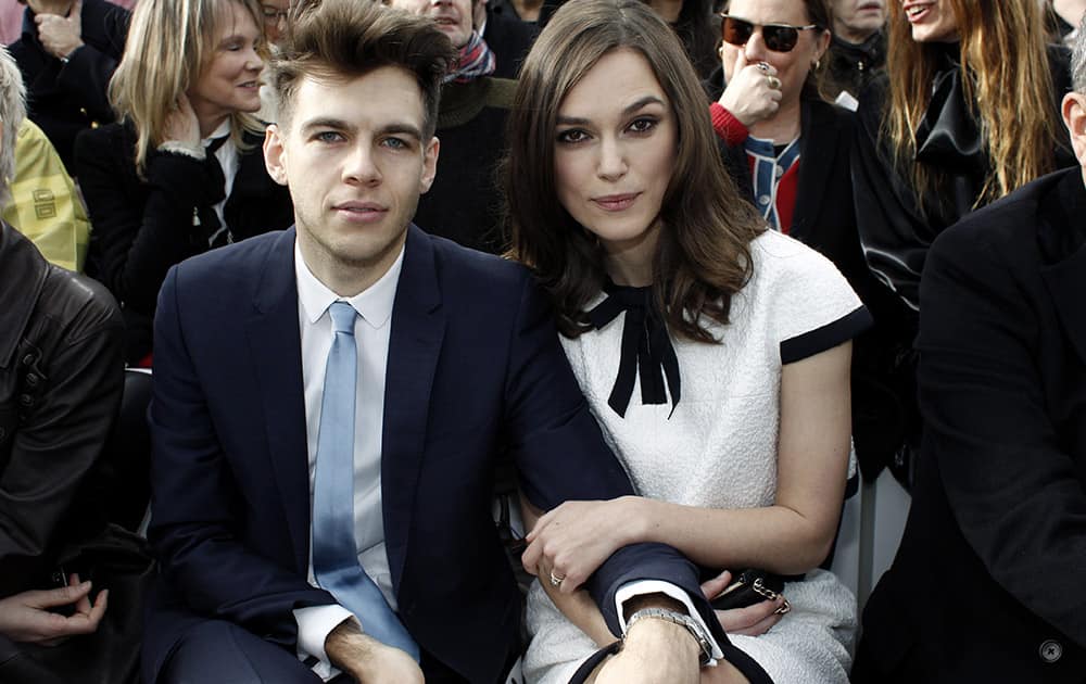 Actress Keira Knightley and her husband James Righton pose as they attend Chanel's ready to wear fall/winter 2014-2015 fashion collection presented in Paris.