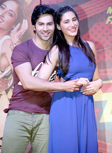 Bollywood actors Varun Dhawan with Nargis Fakhri during the music launch of their upcoming film Main Tera Hero in Mumbai.