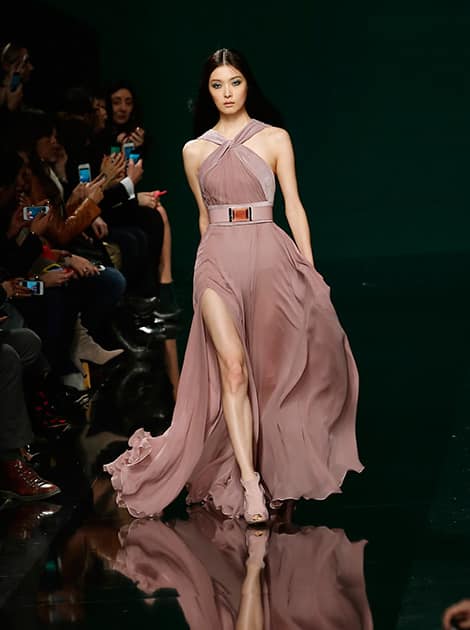 A model wears a creation for Elie Saab's ready-to-wear fall/winter 2014-2015 fashion collection presented in Paris.