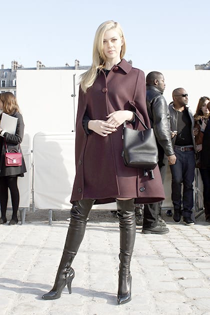 US actress Nicola Peltz poses as she arrives at Vuitton's ready to wear fall/winter 2014-2015 fashion collection presented in Paris.