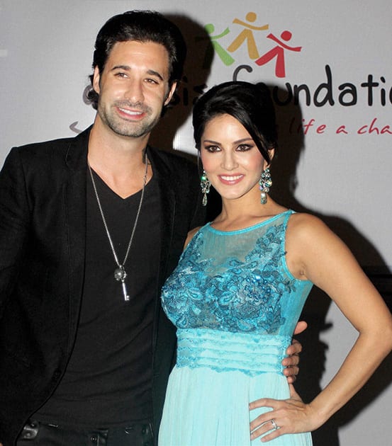 Sunny Leone with her husband Daniel Weber at an event in Mumbai.