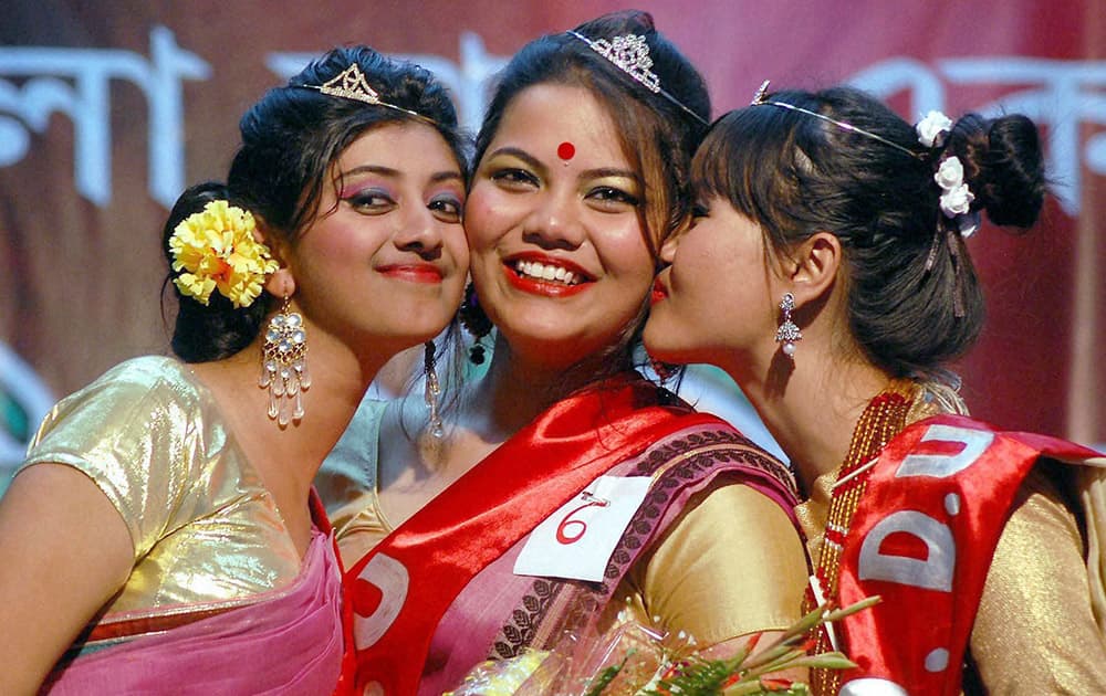 Winners of the Miss Dibrugarh University fashion show competition 2014, pose for a photo in Dibrugarh.