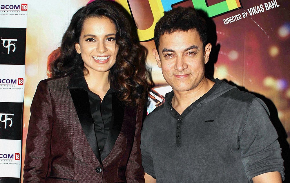 Bollywood actor Aamir Khan and actress Kangana Ranaut during special screening of the film Queen in Mumbai.