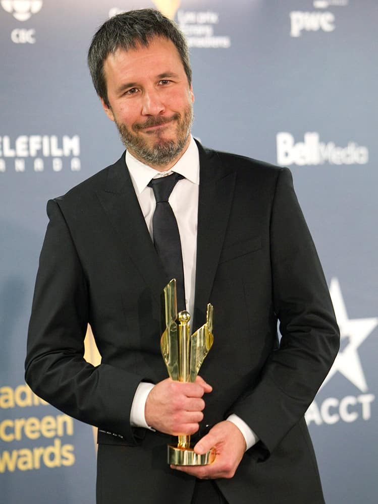 Director Denis Villeneuve with his award for the film `Enemy` at the Canadian Screen Awards in Toronto.