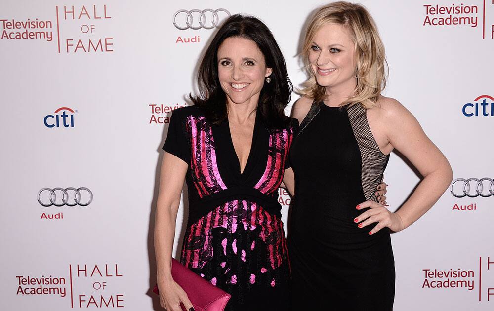 Actress Amy Poehler, right, and actress Julia Louis-Dreyfus attend the 2014 Television Academy Hall of Fame in Beverly Hills, Calif. 