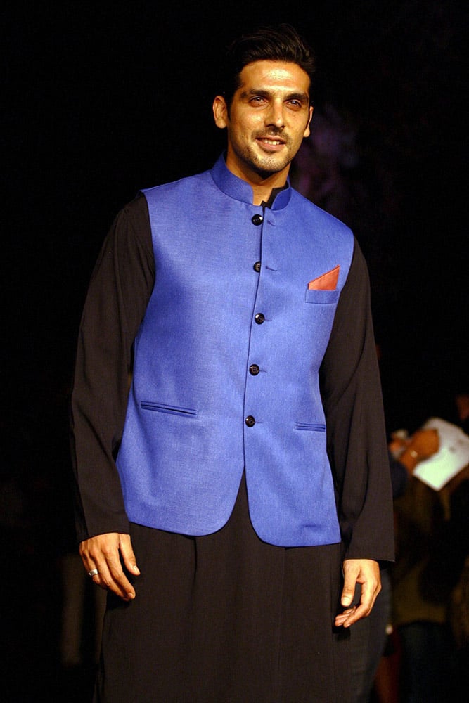 Bollywood Actor Zayed Khan walks the ramp during a fashion show, displaying a designer's collection, on the opening day Lakme Fashion Week 2014, in Mumbai.