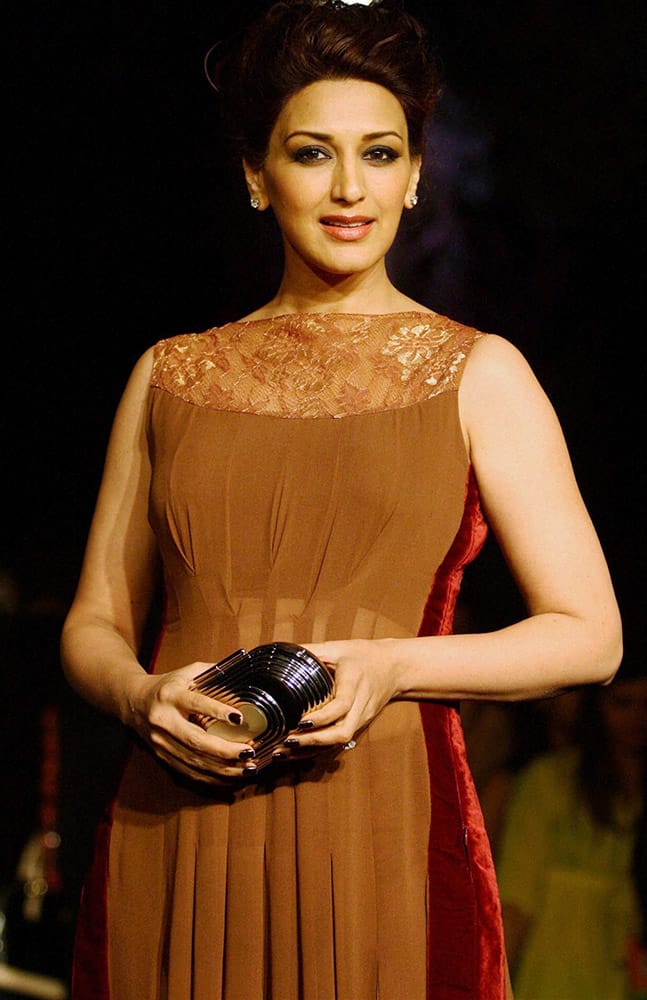 Bollywood Actress Sonali Bendre displays a designer's collection during the opening session of Lakme Fashion Week 2014, in Mumbai.