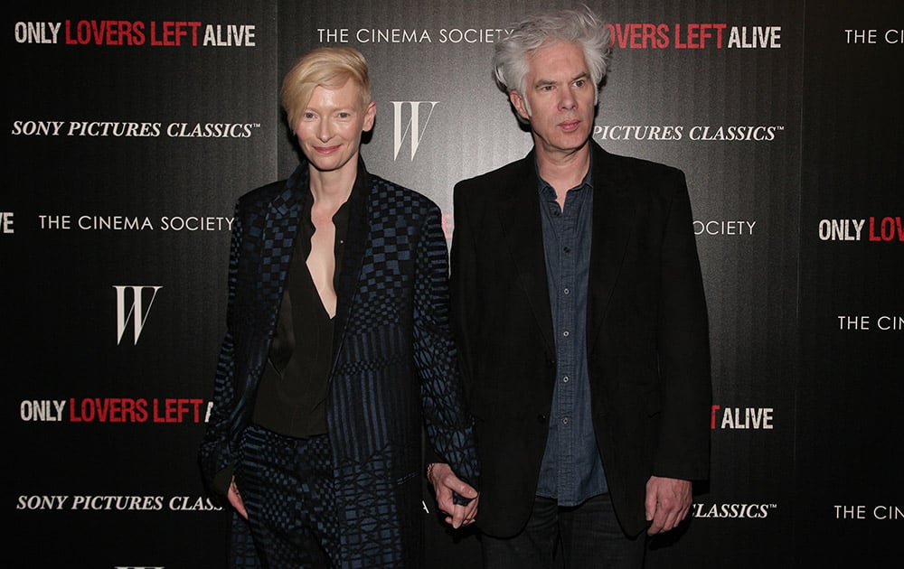 Actress Tilda Swinton, left, and director Jim Jarmusch, attend a screening of `Only Lovers Left Alive` hosted by the Cinema Society and W Magazine in New York.