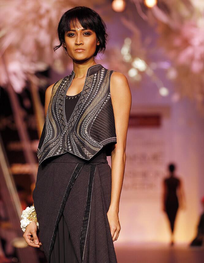 A model walks the ramp to showcase a creation by Tarun Tahiliani during the Lakme Fashion Week in Mumbai.