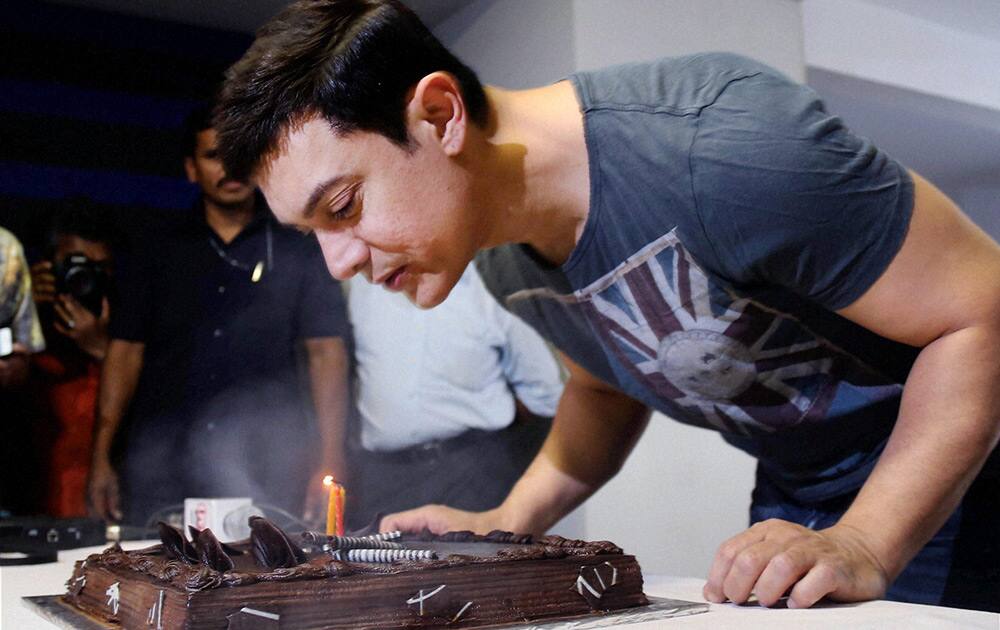 Amir Khan celebrates his 49th birthday at his home in Mumbai .