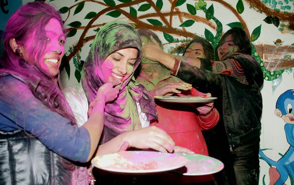 College girls celebrate Holi, the festival of colors in Jammu.