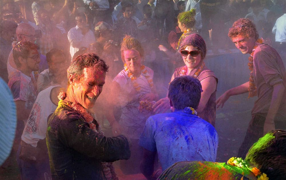 Foreign tourists celebrate Holi in Jodhpur.