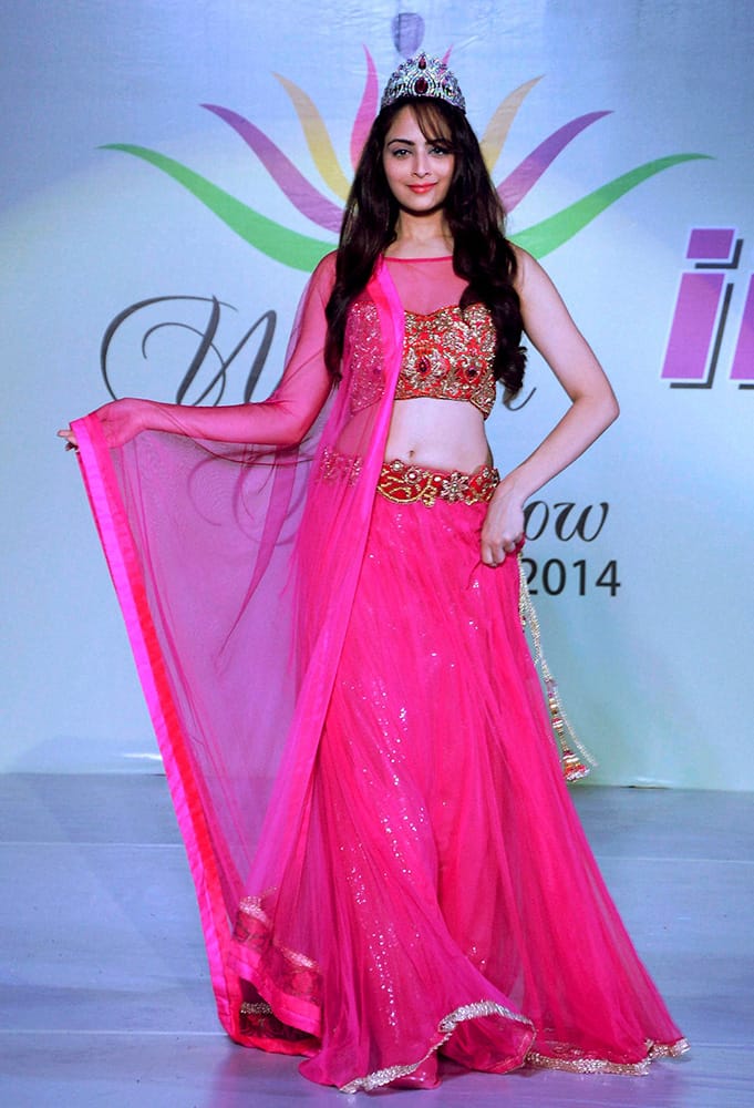 Miss India International 2013 Zoya Afroz walks the ramp at a fashion show at International Institute of Fashion Technology in Bhopal.