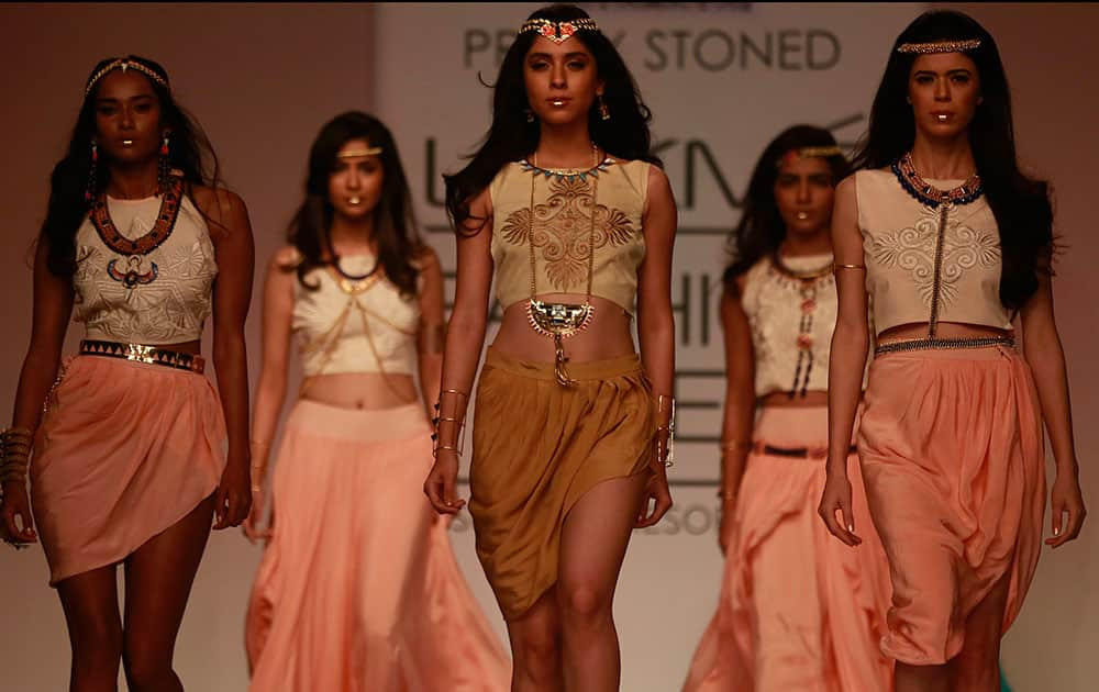 Models display creations by designers Pretty Stoned during the Lakme Fashion Week in Mumbai.