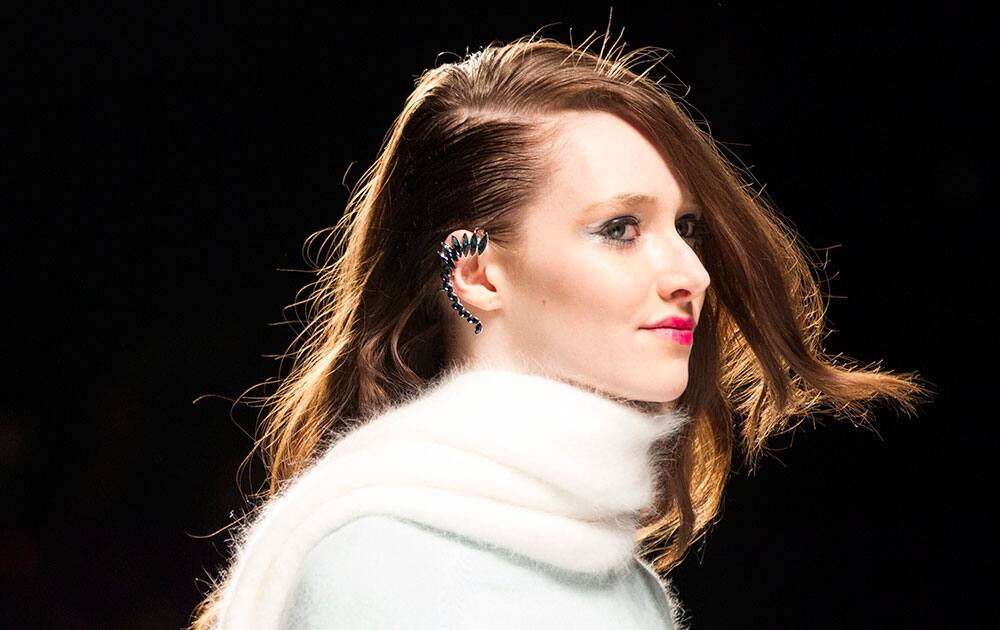 A model shows a creation from Line Knitwear while walking the runway during Toronto Fashion Week.