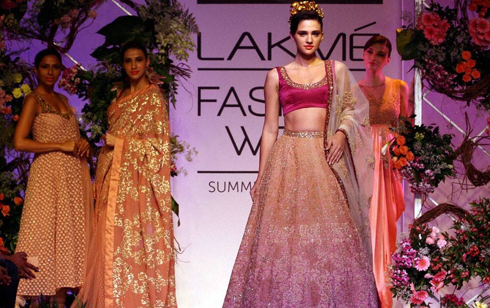 Models walk the ramp during the Lakme Fashion Week (LFW) 2014 in Mumbai.