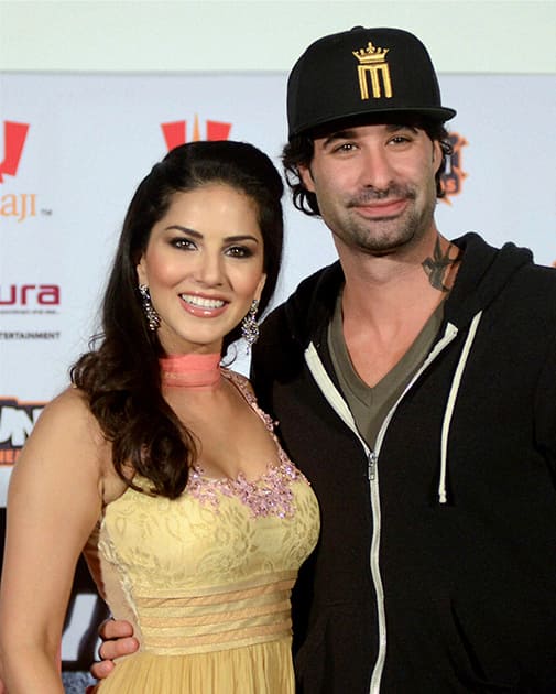 Indo-Canadian actress Sunny Leone with husband Daniel Weber after a press conference to promote her upcoming film 'Ragini MMS 2' in Bhopal.