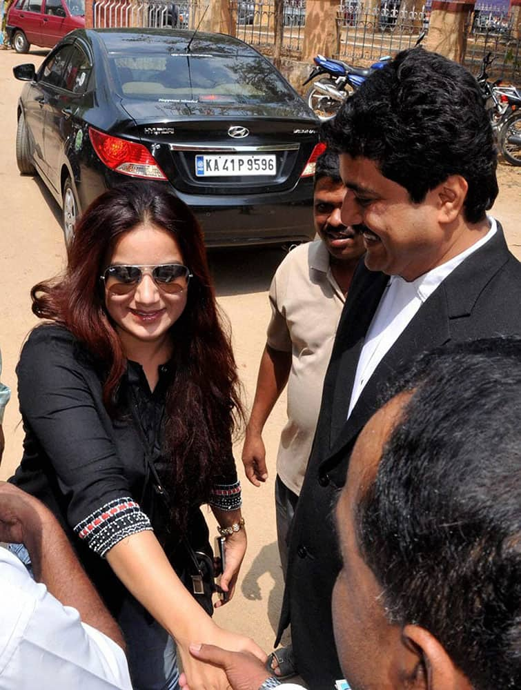 Kannada actress Pooja Gandhi meets her laywer while appearing before the court in relation to violation of code of conduct in 2012 election, in Chikamagular.