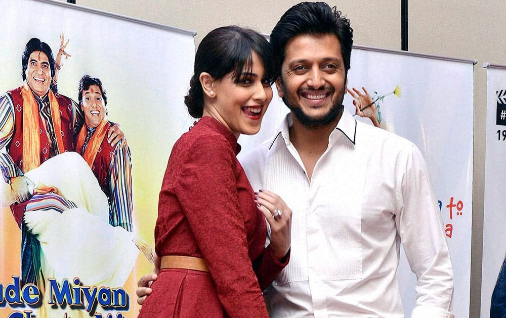 Bollywood actor Riteish Deshmukh with his wife and actress Genelia D'Souza during the 25th movie celebration of filmmaker Vasu Bhagnani in Mumbai.