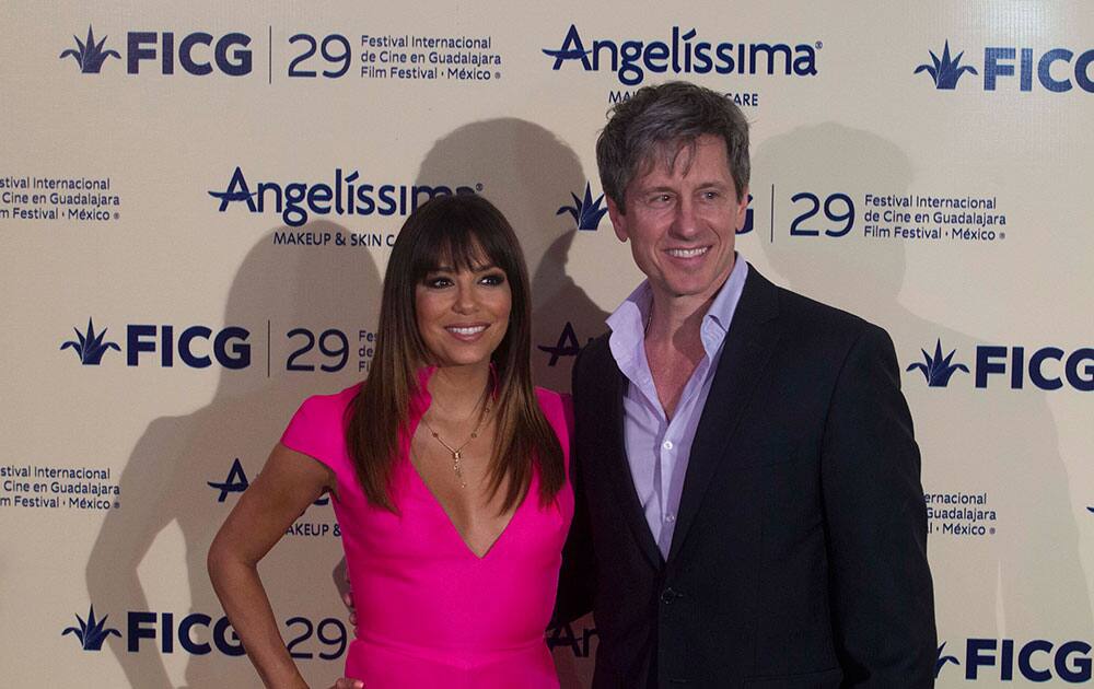 Actress Eva Longoria and director Michel Berry arrive at the premiere of his new film `Border`, during the International Film Festival of Guadalajara in Guadalajara, Mexico.