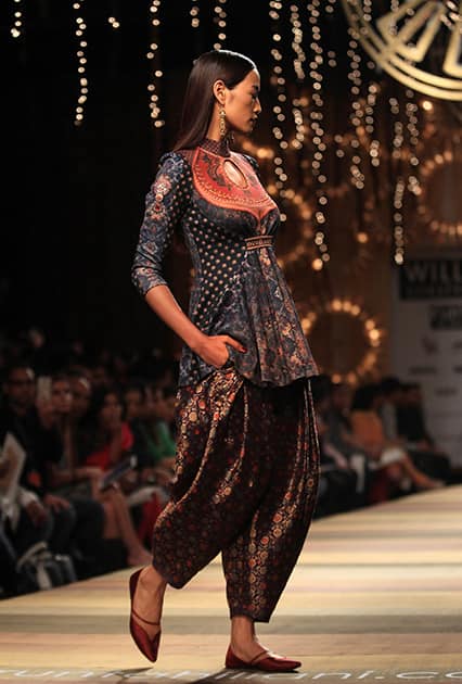 A model displays a creation by Tarun Tahiliani during the Wills lifestyle Fashion Week in New Delhi.