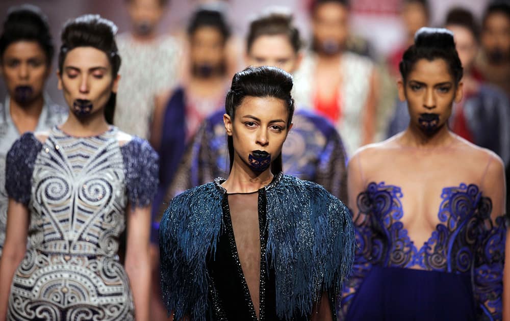 Models display creations by Nachiket Barve during the Wills Lifestyle Fashion Week in New Delhi.