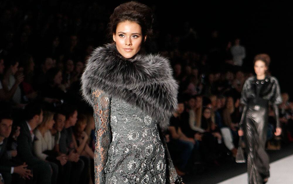 A model displays a creation by Russian designer Igor Gulyaev at the Fashion Week in Moscow, Russia.