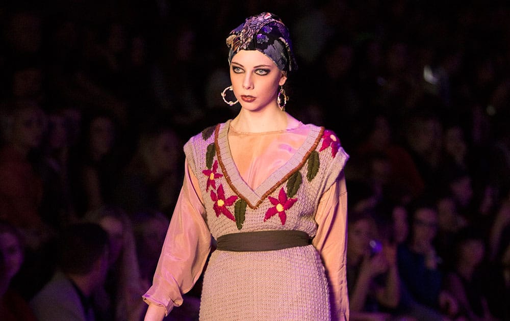 A model displays creations by Georgian designer Goga Nikabadze at the Fashion Week in Moscow.