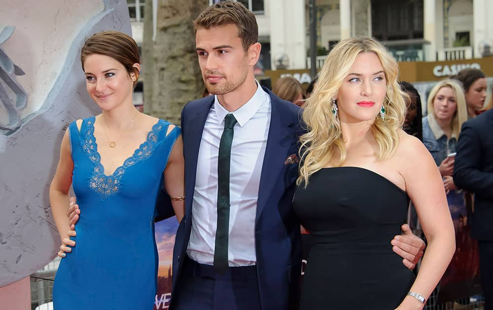 From left, US actress Shailene Woodley, and British actors Theo James and Kate Winslet arrive for the European premiere of Divergent at a central London cinema, London.