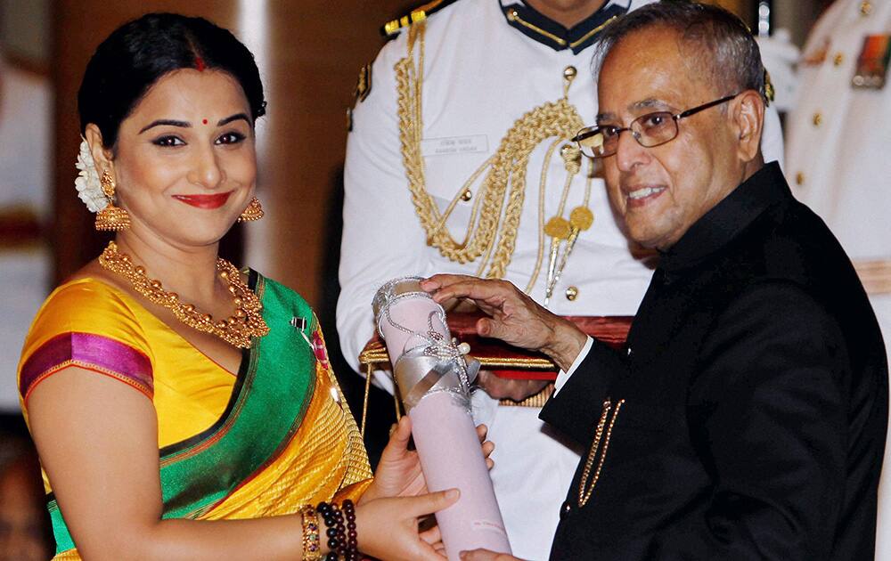 President Pranab Mukherjee presents Padma Shri to actress Vidya Balan during Padma Awards 2014 at Rashtrapati Bhavan in New Delhi.