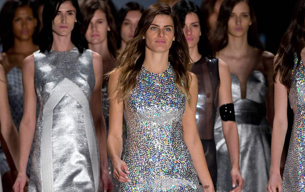 Brazilian model Isabeli Fontana, front, and other models wear creations from the Tufi Duek Summer collection at Sao Paulo Fashion Week.